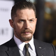 Illustration for article titled PSA: Tom Hardy Recently Filmed a Scene Wearing Only a Tattoo and a Necklace
